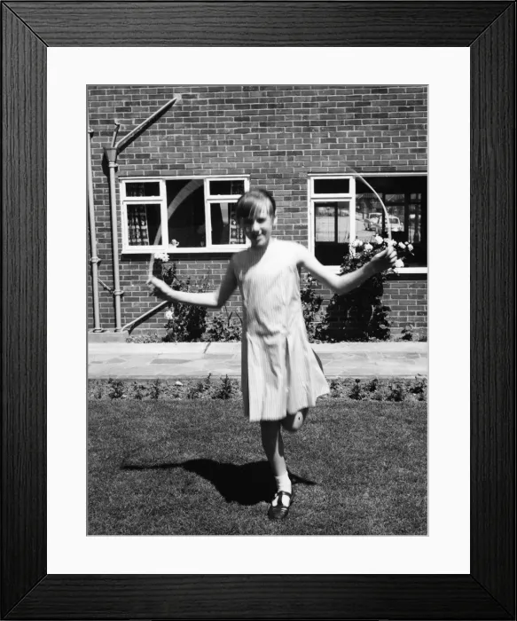 Framed Print : Girl Skips in Garden Framed Print : Girl Skips in Garden