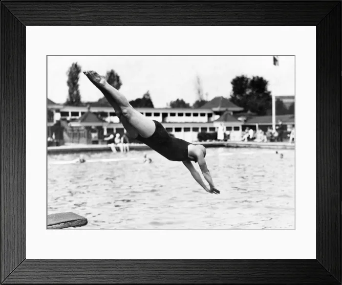 Framed Print : DIVE IN. A woman in a swimming costume dives into a lido! Date: 1930s Framed Print : DIVE IN. A woman in a swimming costume dives into a lido! Date: 1930s