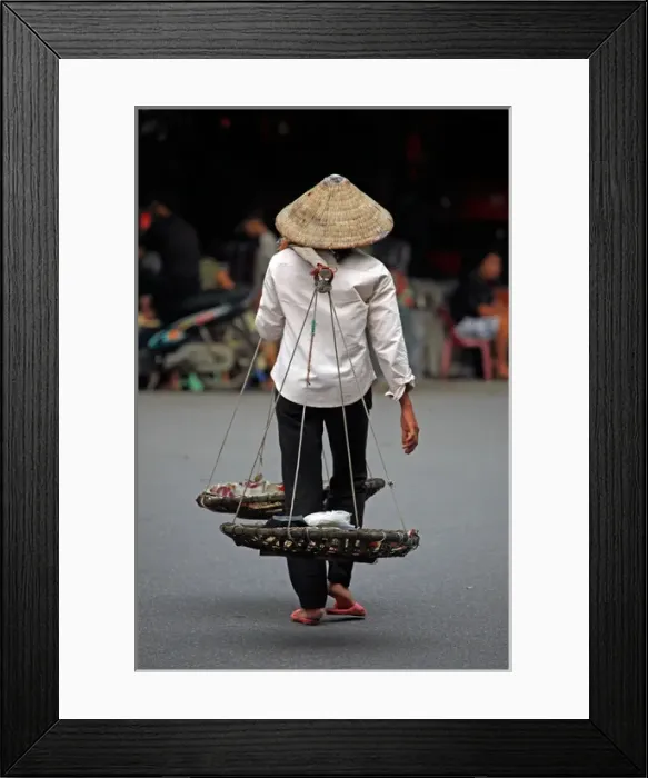 Framed Print : Person carrying traditional baskets in Hanoi, Vietnam Framed Print : Person carrying traditional baskets in Hanoi, Vietnam