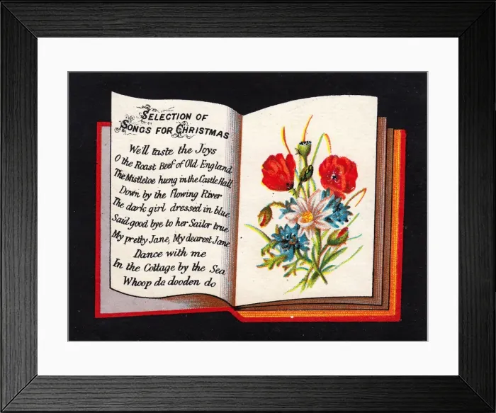 Framed Print : Book with song titles on a Christmas card Framed Print : Book with song titles on a Christmas card