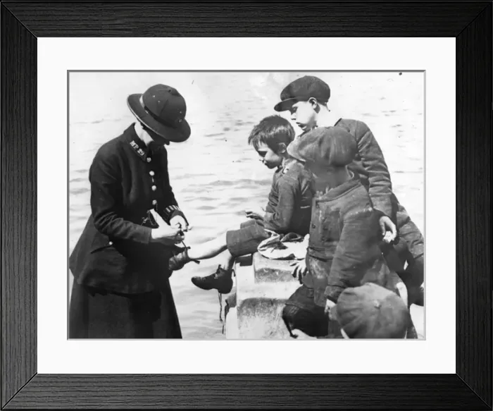 Framed Print : Woman police officer with small boys, London Framed Print : Woman police officer with small boys, London