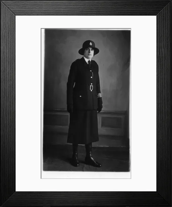 Framed Print : Woman police officer in studio photo Framed Print : Woman police officer in studio photo