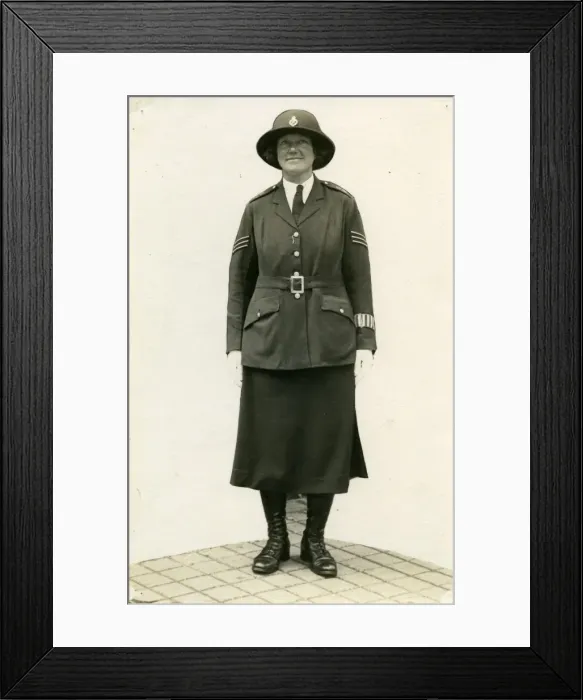 Framed Print : Woman police officer posing in uniform, London Framed Print : Woman police officer posing in uniform, London