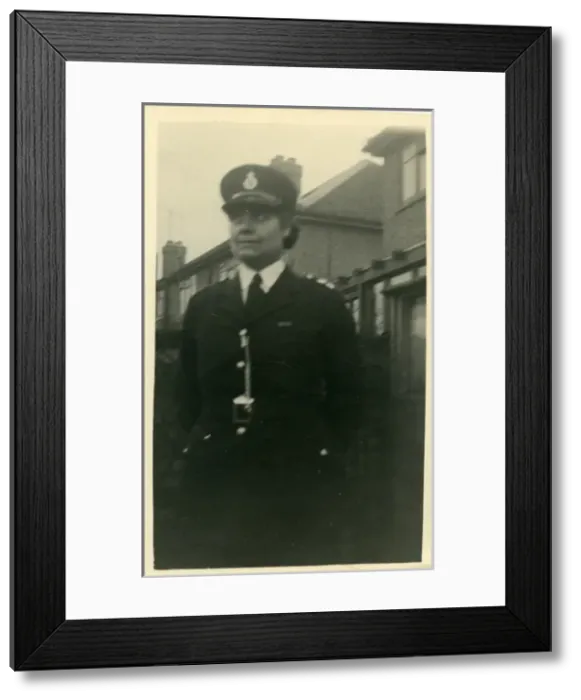 Framed Print : Woman police officer on duty in a London street Framed Print : Woman police officer on duty in a London street