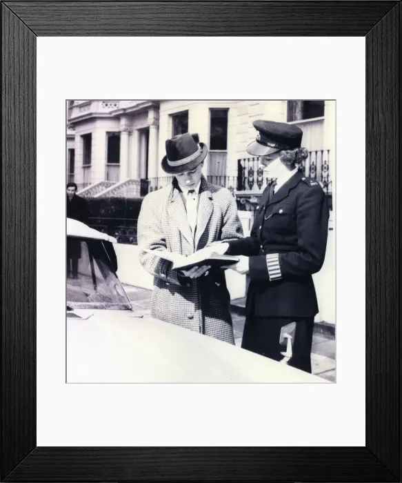 Framed Print : Woman police officer helping a driver, London Framed Print : Woman police officer helping a driver, London