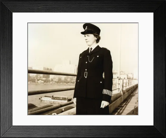 Framed Print : Woman police officer on a bridge in London Framed Print : Woman police officer on a bridge in London