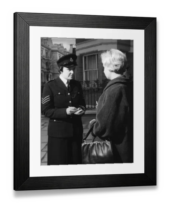 Framed Print : Woman police officer and woman with handbag Framed Print : Woman police officer and woman with handbag