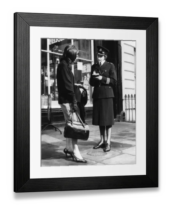 Framed Print : Woman police officer and woman with handbag, London Framed Print : Woman police officer and woman with handbag, London