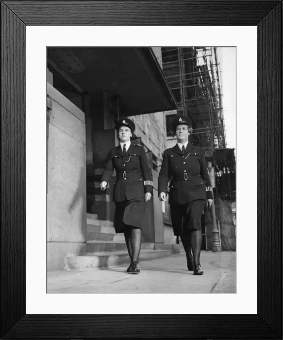 Framed Print : Two women police officers walking along London street Framed Print : Two women police officers walking along London street