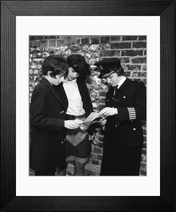 Framed Print : Woman police officer and two young women, London Framed Print : Woman police officer and two young women, London