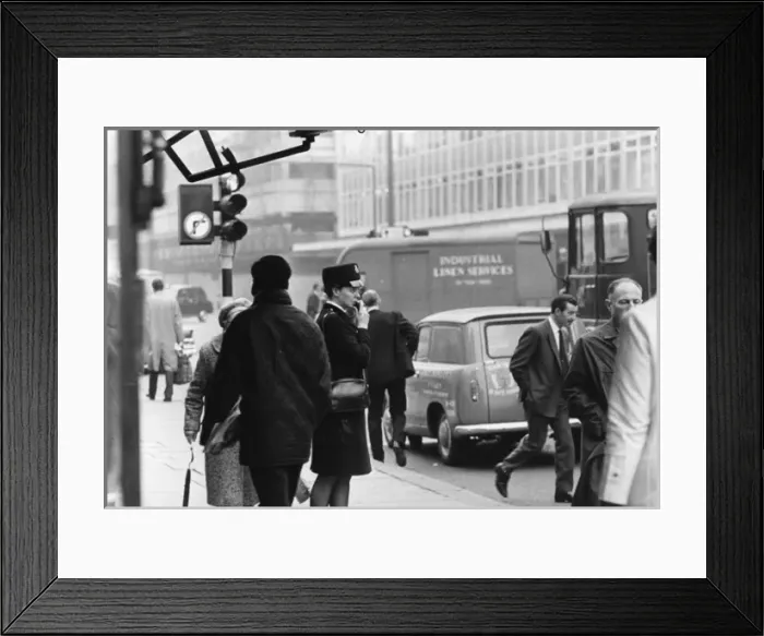 Framed Print : Woman police officer on a busy London street Framed Print : Woman police officer on a busy London street