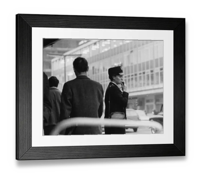 Framed Print : Woman police officer on a busy London street