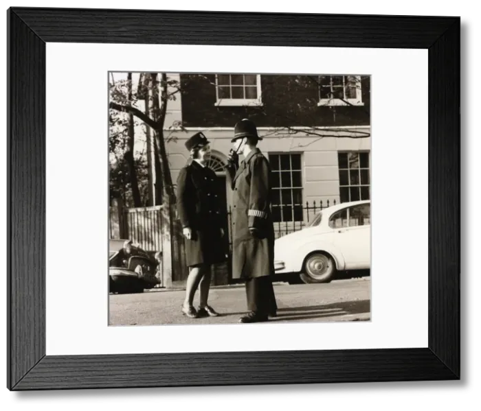 Framed Print : Male and female police officers in a London street Framed Print : Male and female police officers in a London street