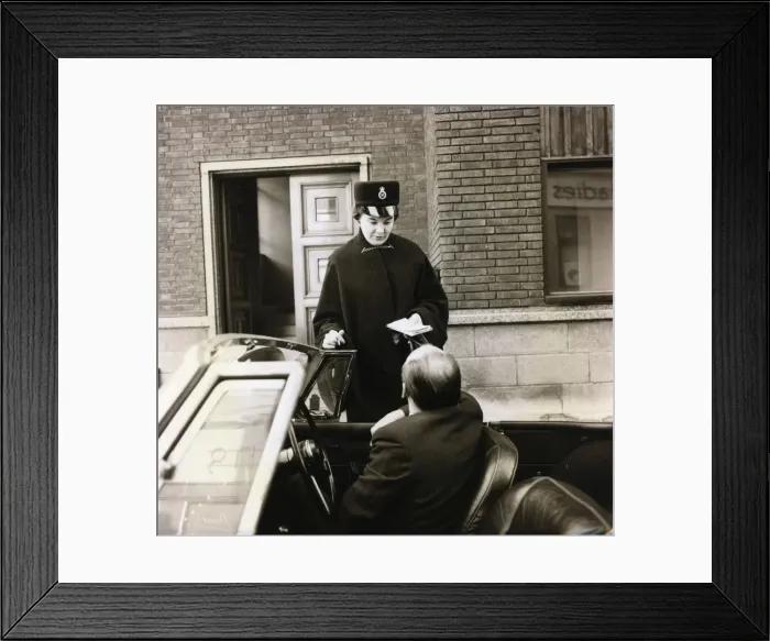 Framed Print : Woman police officer with car driver on a London street Framed Print : Woman police officer with car driver on a London street
