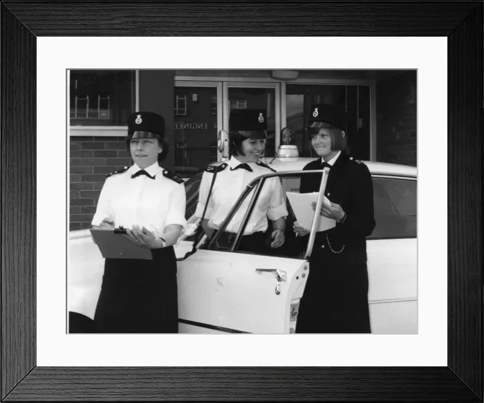 Framed Print : Three women police officers standing by a car, London Framed Print : Three women police officers standing by a car, London