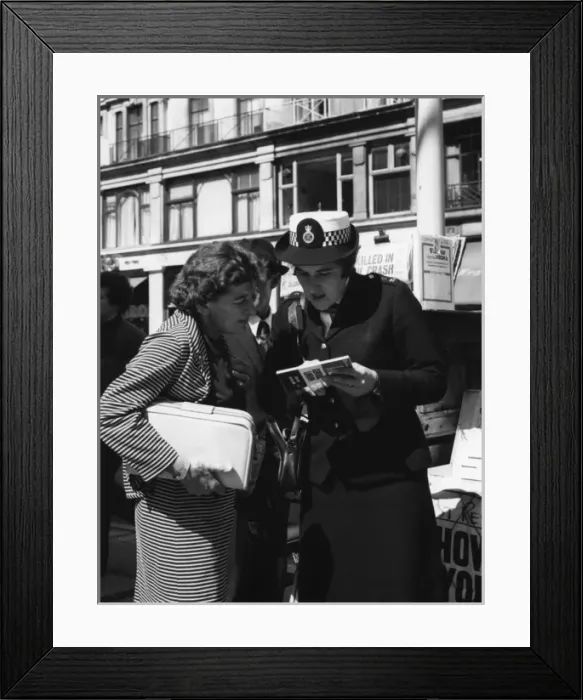 Framed Print : Woman police officer on duty in London Framed Print : Woman police officer on duty in London