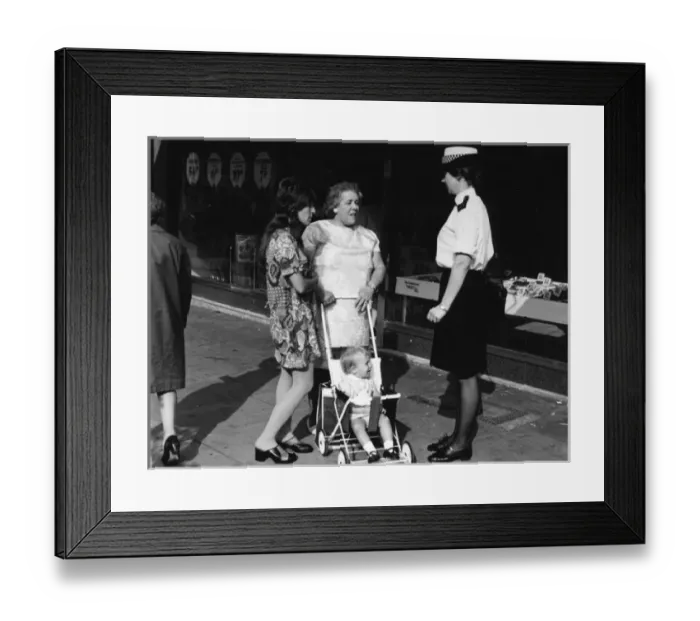 Framed Print : Woman police officer on duty in London Framed Print : Woman police officer on duty in London