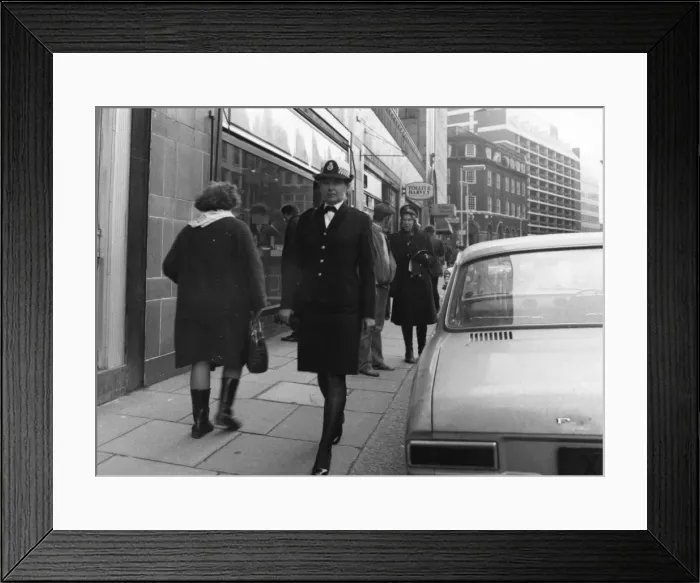 Framed Print : Woman police officer on duty in London Framed Print : Woman police officer on duty in London