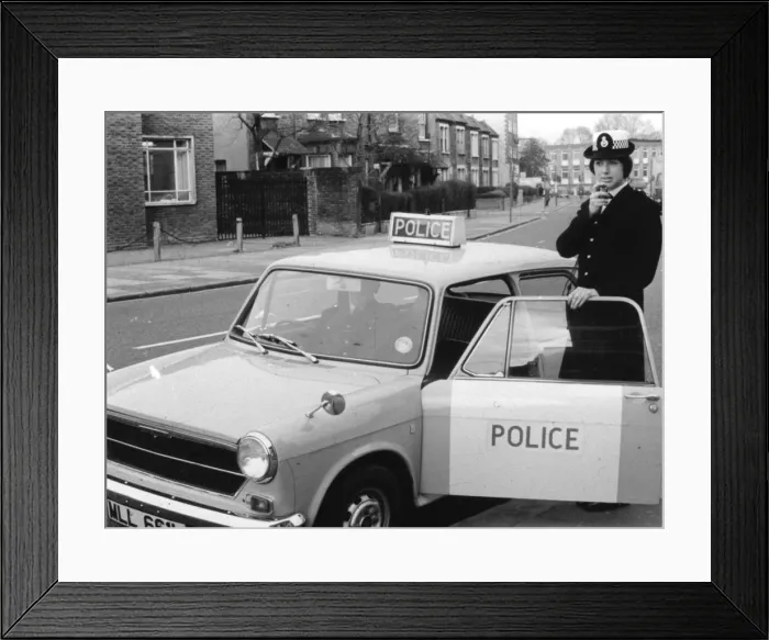 Framed Print : Woman police officer on duty in London