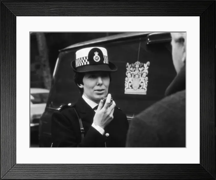 Framed Print : Woman police officer on duty in London Framed Print : Woman police officer on duty in London