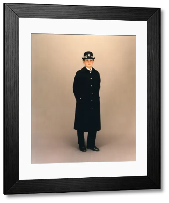 Framed Print : Woman police officer in coat and bowler hat, London Framed Print : Woman police officer in coat and bowler hat, London
