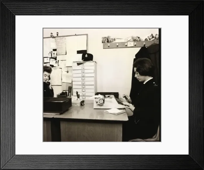 Framed Print : Woman police officer working in a police station Framed Print : Woman police officer working in a police station