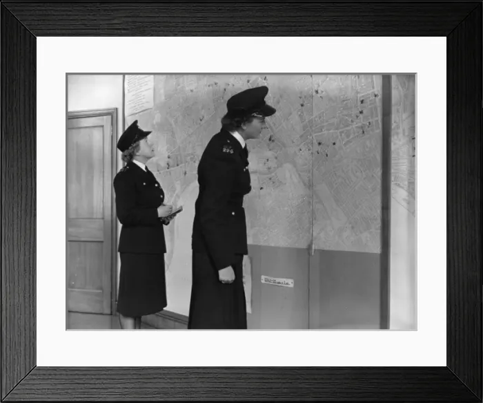Framed Print : Two women police officers working in a station, London Framed Print : Two women police officers working in a station, London