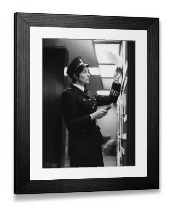 Framed Print : Woman police officer at work in a London police station Framed Print : Woman police officer at work in a London police station