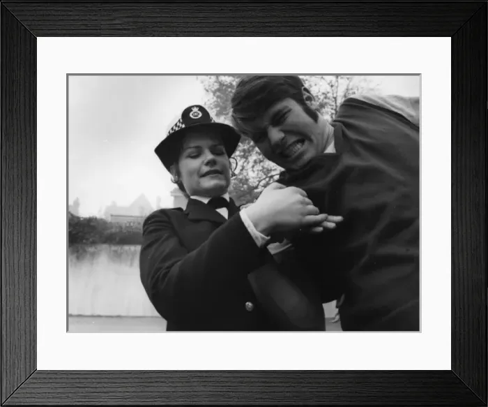 Framed Print : Woman police officer in self-defence training exercise Framed Print : Woman police officer in self-defence training exercise