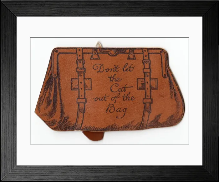 Framed Print : Brown leather bag on a greetings card Framed Print : Brown leather bag on a greetings card