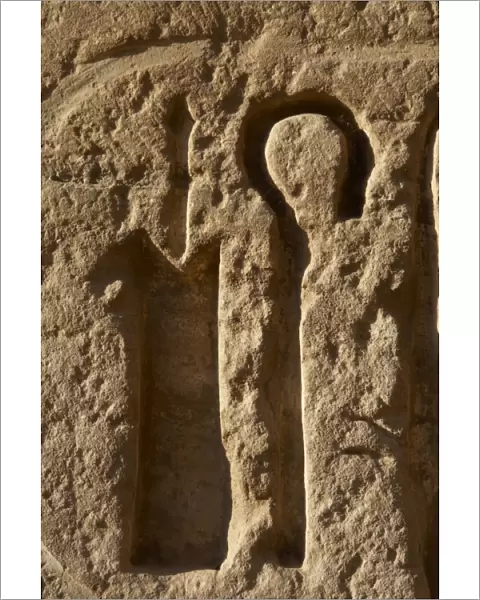 Relief with hieroglyphic symbols. Crook. Temple of Ramses II