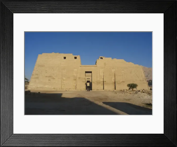 Framed Print : Temple of Ramses III. First pylon with reliefs depicting bat Framed Print : Temple of Ramses III. First pylon with reliefs depicting bat