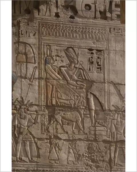 Temple of Ramses III. Ramses III wearing Khepresh being carr