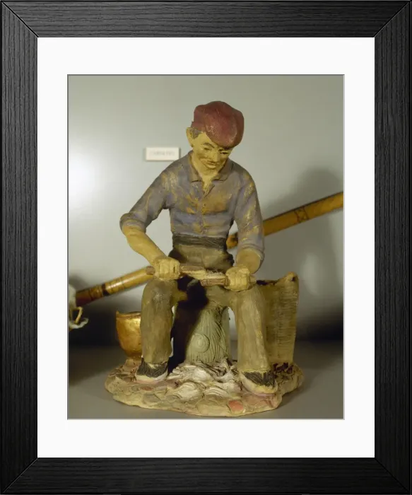 Framed Print : Figurine depicting a carder Framed Print : Figurine depicting a carder