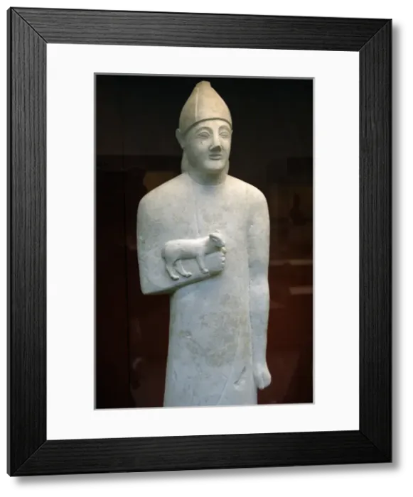 Framed Print : Statue of a devotee holding a small animal as an offering. L Framed Print : Statue of a devotee holding a small animal as an offering. L