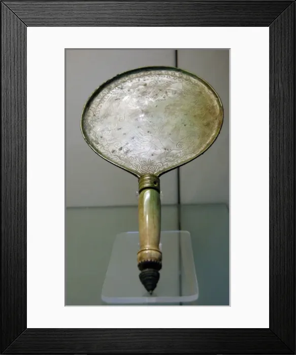 Framed Print : Bronze mirror with bone handle engraved with a scene depicti Framed Print : Bronze mirror with bone handle engraved with a scene depicti