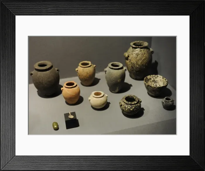 Framed Print : Stone jars and bowls with a small spoon and a small grinding Framed Print : Stone jars and bowls with a small spoon and a small grinding