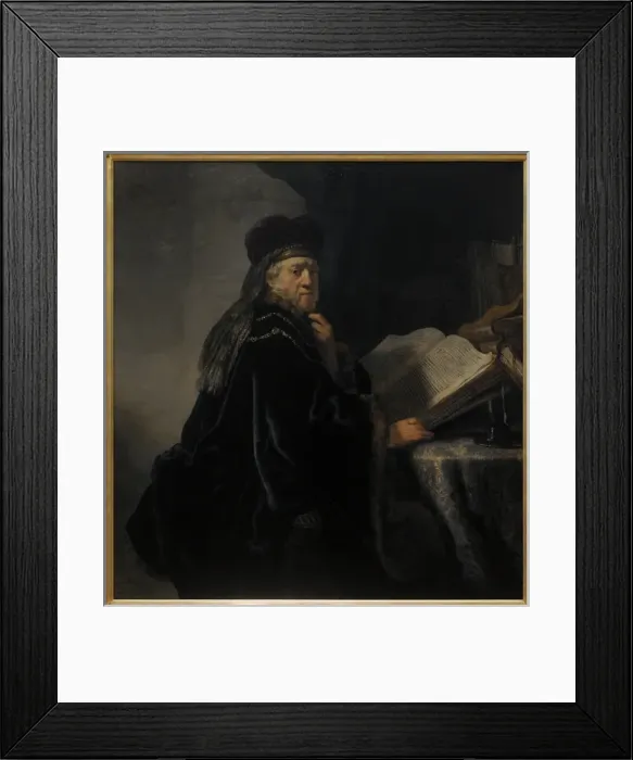 Framed Print : Rembrandt van Rijn (1606-1669). A Scholar in his study or A Framed Print : Rembrandt van Rijn (1606-1669). A Scholar in his study or A
