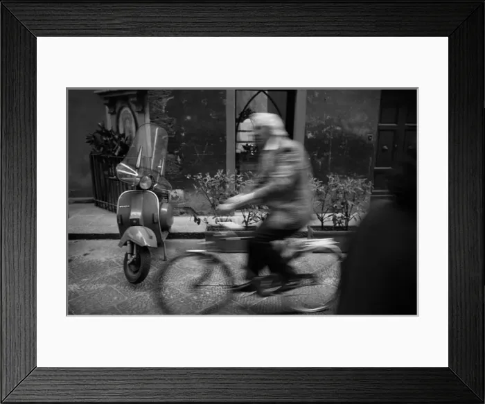 Framed Print : Moving figure on bike, motor scooter, Italy Framed Print : Moving figure on bike, motor scooter, Italy