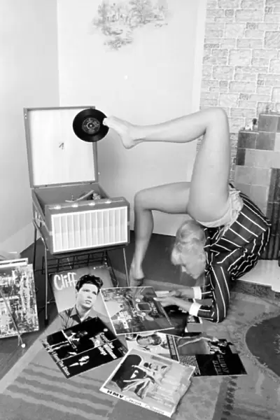Female contortionist Diana Gaye playing records