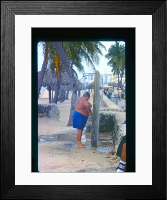 Framed Print : Large man taking a shower, Florida, USA Framed Print : Large man taking a shower, Florida, USA