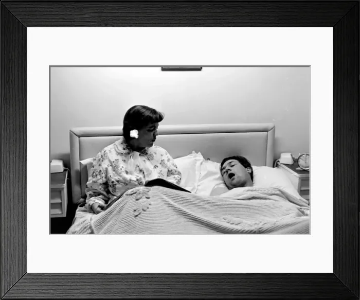 Framed Print : Woman with snoring husband Framed Print : Woman with snoring husband