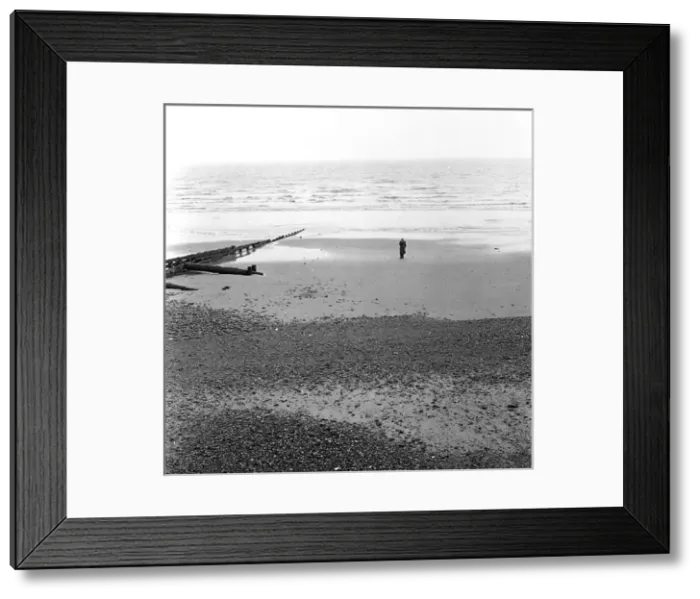 Framed Print : Solitary man on the beach at Eastbourne, Sussex Framed Print : Solitary man on the beach at Eastbourne, Sussex