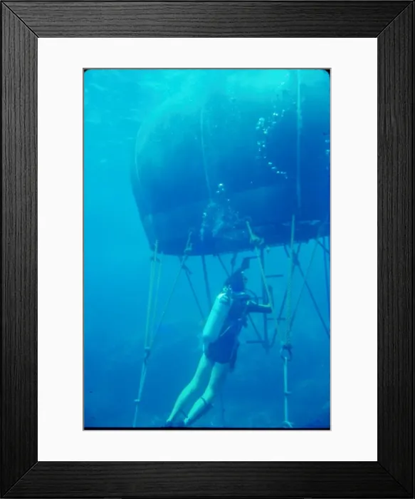 Framed Print : Diver with underwater house off the coast of Malta