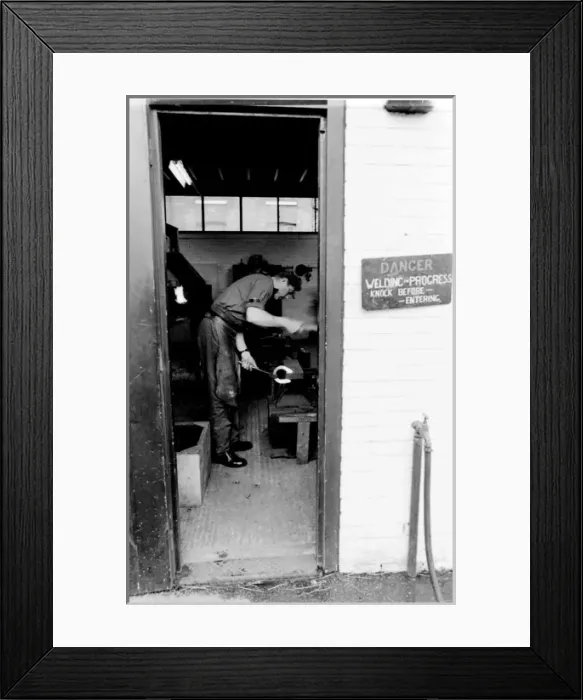 Framed Print : Blacksmith at work on a horseshoe Framed Print : Blacksmith at work on a horseshoe