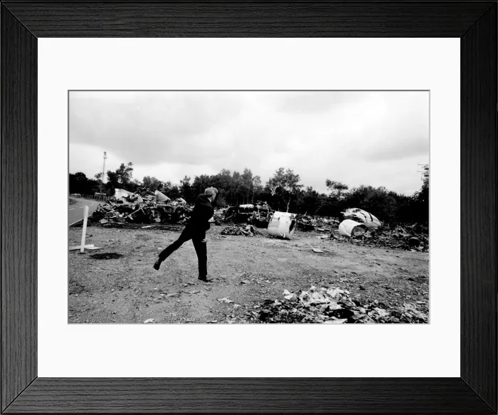 Framed Print : Air crash investigator examining debris
