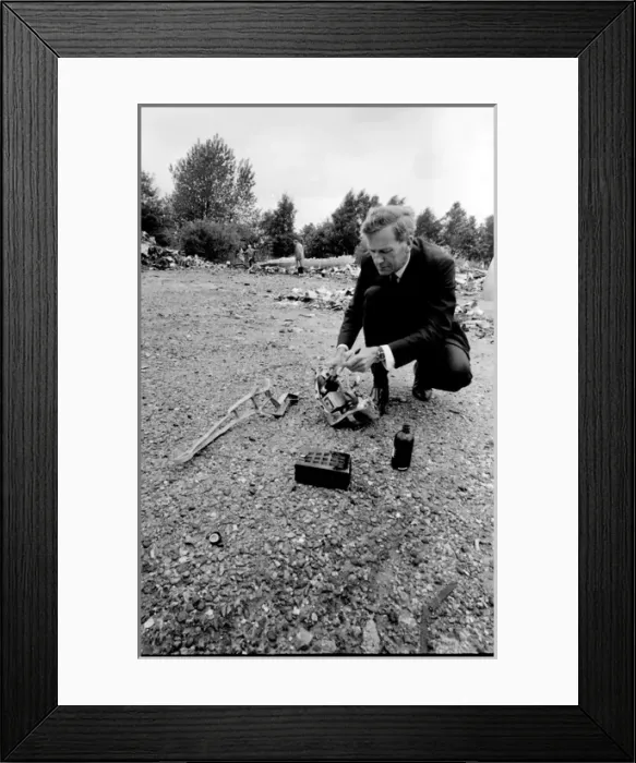 Framed Print : Air crash investigator examining debris Framed Print : Air crash investigator examining debris