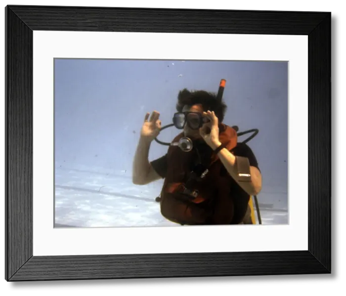 Framed Print : Learning to scuba dive in a swimming pool Framed Print : Learning to scuba dive in a swimming pool