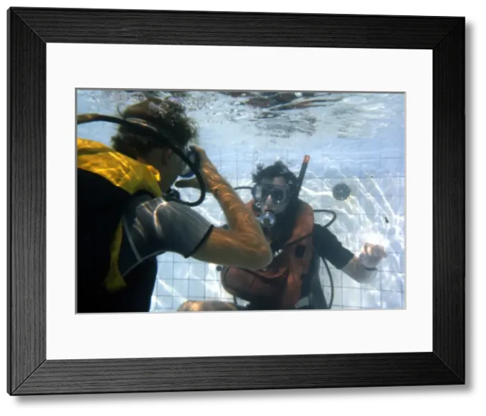 Framed Print : Learning to scuba dive in a swimming pool Framed Print : Learning to scuba dive in a swimming pool