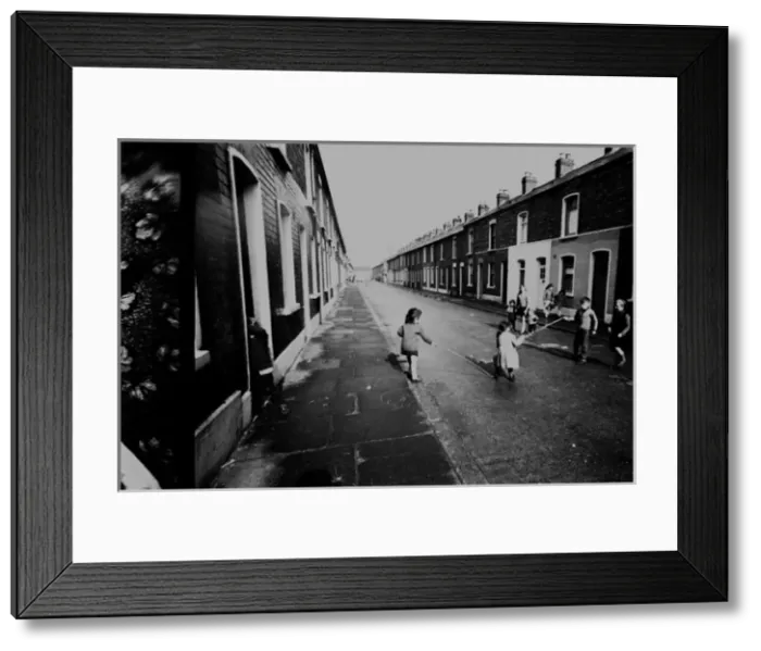 Framed Print : Children skipping in a street, Belfast, Northern Ireland Framed Print : Children skipping in a street, Belfast, Northern Ireland